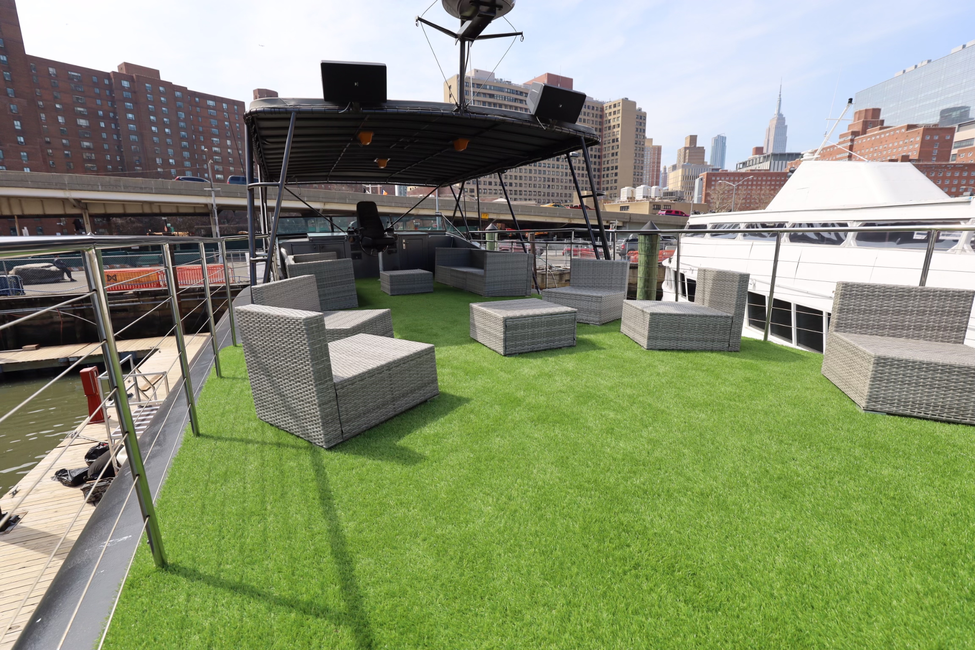 Unity yacht rooftop lounge with Manhattan skyline