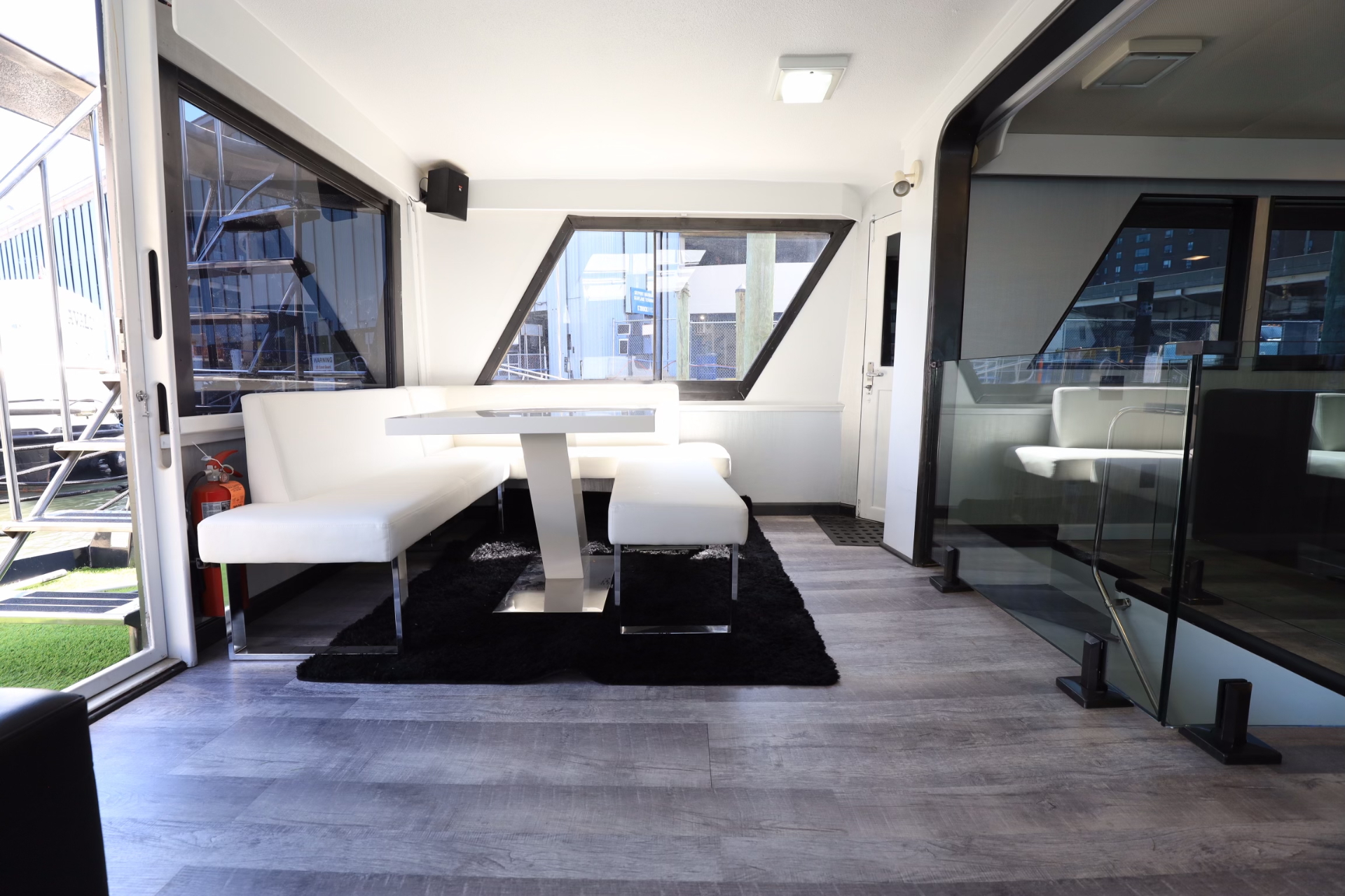 Unity interior lounge with white banquette seating in daylight